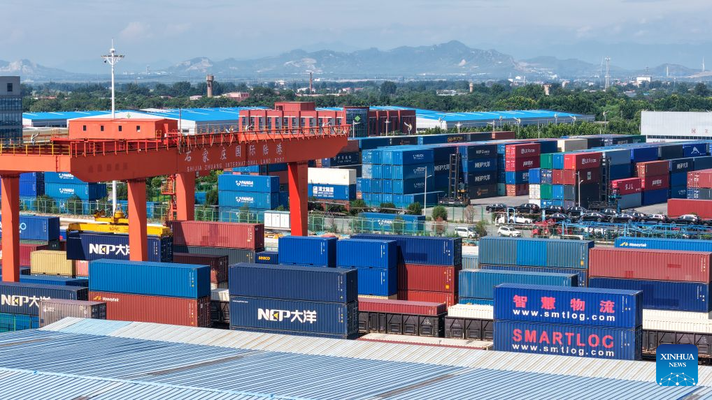 This drone photo taken on Aug. 4, 2026 shows a container loading site of the Shijiazhuang international land port in north China's Hebei Province. Shijiazhuang international land port in north China's Hebei Province handled a total of 814 China-Europe and China-Central Asia freight train trips in the first half of 2026, up 42.06 percent year on year. (Photo by Liang Zidong/Xinhua)