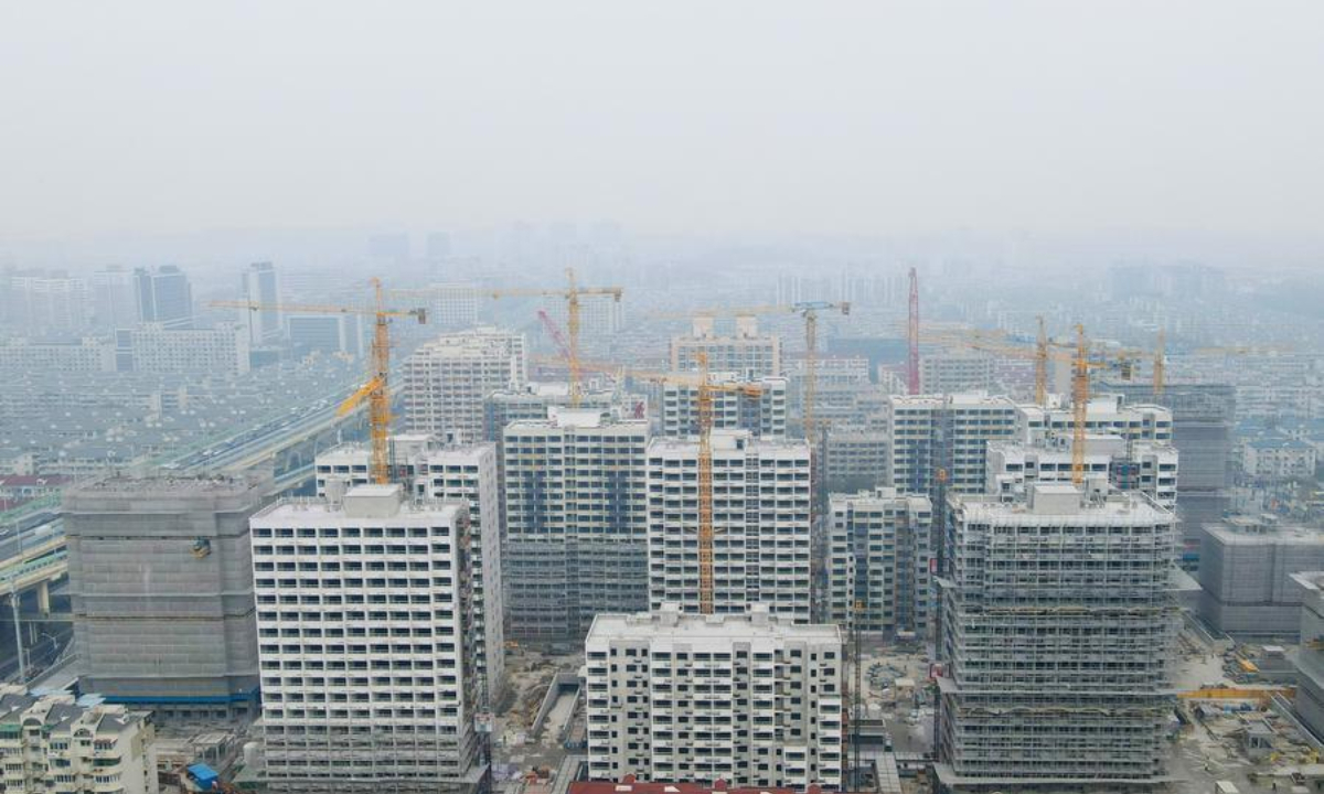 An aerial drone photo taken on Jan. 10, 2024 shows the construction site of the renewal project at Pengyi residential compound in Jing'an District, east China's Shanghai. (Xinhua/Fang Zhe)