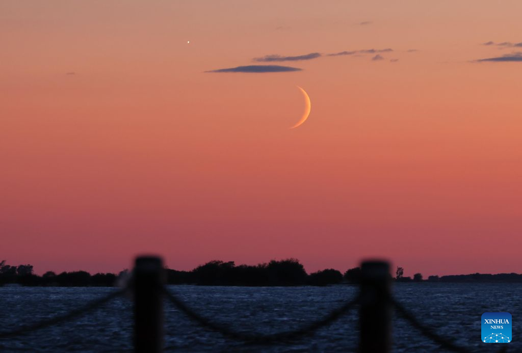 This photo taken on Sept. 14, 2026 shows the planet of Venus next to the moon in the sky over Fujin City, northeast China's Heilongjiang Province. (Photo by Qu Yubao/Xinhua)