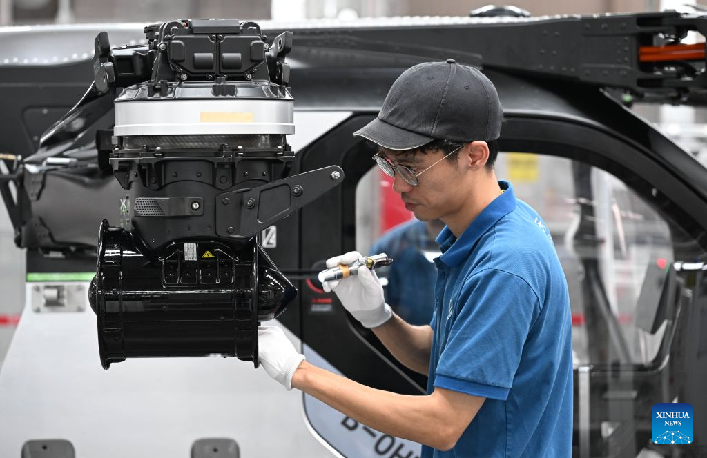 A staff member works at the general assembly workshop of ARIDGE's plant for mass production of flying cars in Guangzhou, south China's Guangdong Province, Aug. 10, 2026.

A roll-off ceremony for the 1,000th set of electric propulsion system for ARIDGE's flying car, dubbed the Land Aircraft Carrier, was held at the company's plant for mass production of flying cars in Guangzhou on Monday.

ARIDGE is a pioneering developer of low-altitude mobility solutions based in Guangdong. Its plant for mass production of flying cars here, covering an area of approximately 120,000 square meters, mainly manufactures the airborne component of the Land Aircraft Carrier. (Xinhua/Deng Hua)