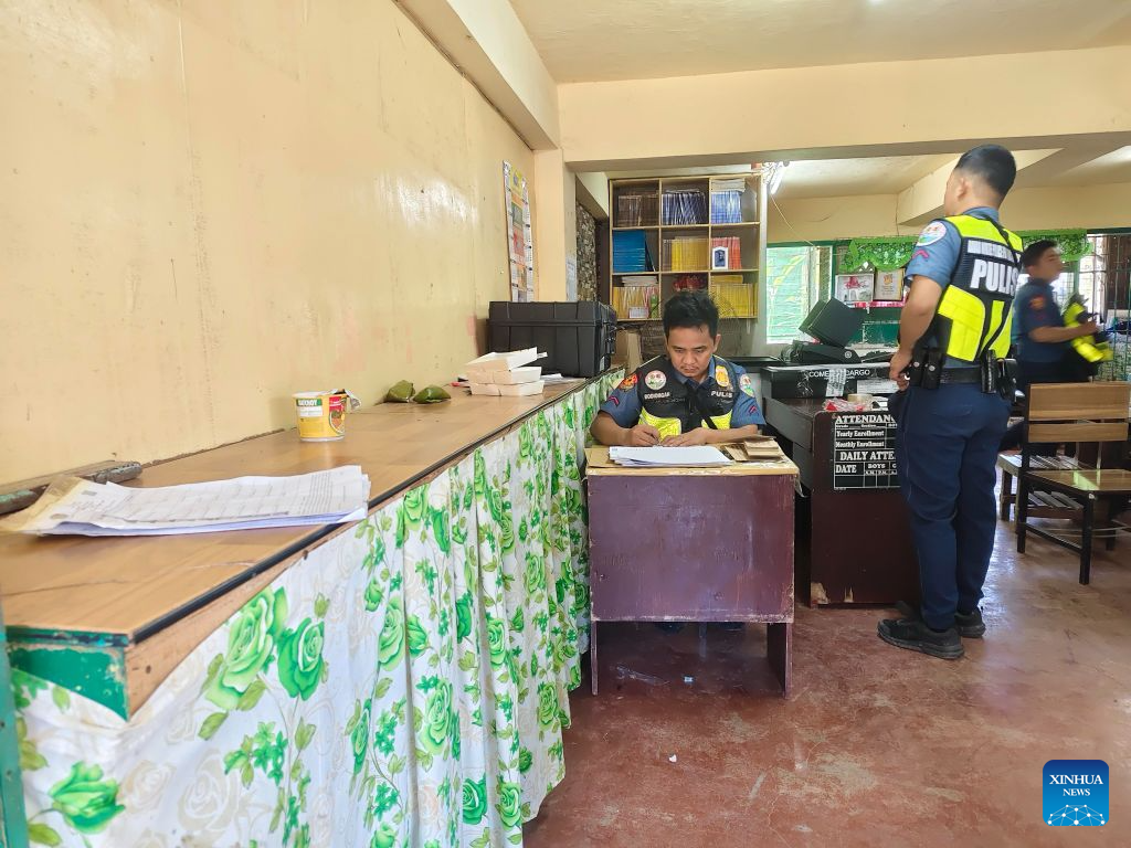 Policemen are seen at a polling center during the parliamentary election in the Bangsamoro Autonomous Region in Muslim Mindanao (BARMM), the Philippines, Sept. 14, 2026. The first parliamentary election in the BARMM began on Monday. According to local media reports, over 2 million voters are eligible to vote for 80 parliamentary seats being contested by 13 parties. Security has been stepped up across the BARMM in recent days, with over 20,000 security personnel deployed to polling areas and rapid response teams set up to deal with potential violence. (Armed Forces of the Philippines/Handout via Xinhua)