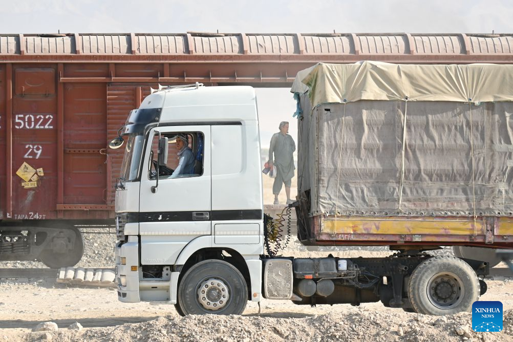 Workers operate at loading area of Hairatan railway port in Balkh Province, northern Afghanistan, Sept. 17, 2026. (Xinhua/Zhang Yibin)