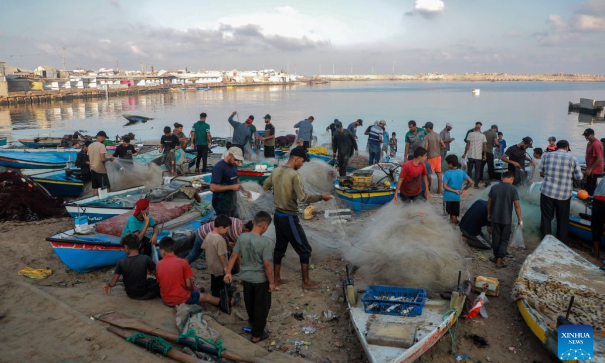 Palestinian fishermen are seen working at Gaza's seaport, in Gaza City, on Sept. 3, 2026. (Photo by Rizek Abdeljawad/Xinhua)