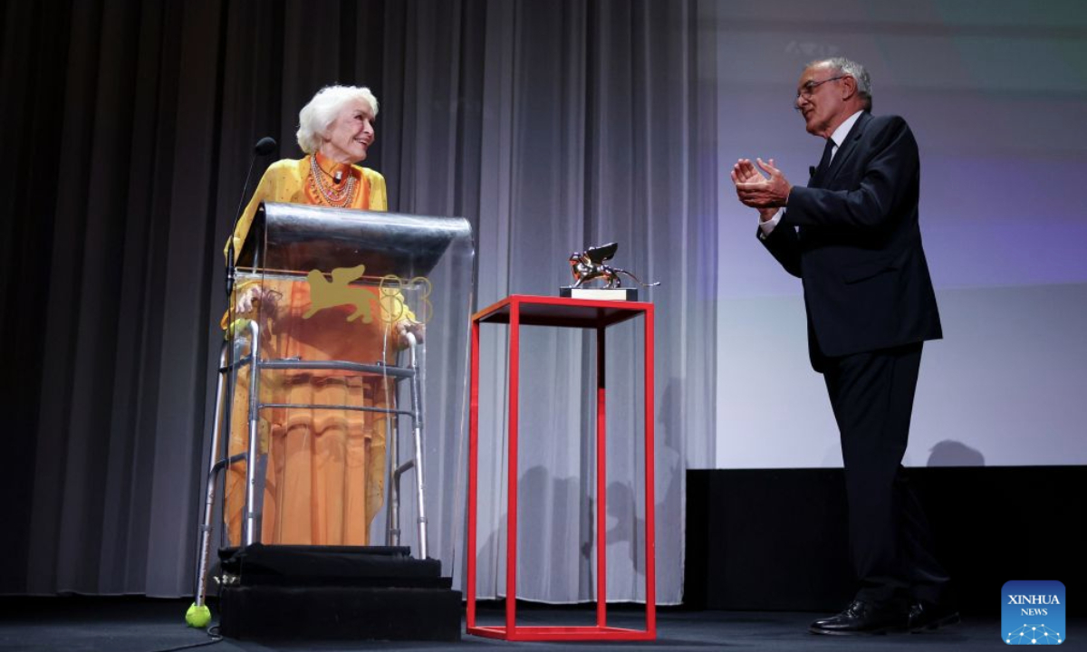 Actress Ellen Burstyn (L) receives congratulations from Alberto Barbera, artistic director of the 83rd Venice International Film Festival, after being awarded the trophy of the Golden Lion for Lifetime Achievement at the 83rd Venice International Film Festival in Venice, Italy, Sept. 7, 2026. (Xinhua/Wang Kaiyan)