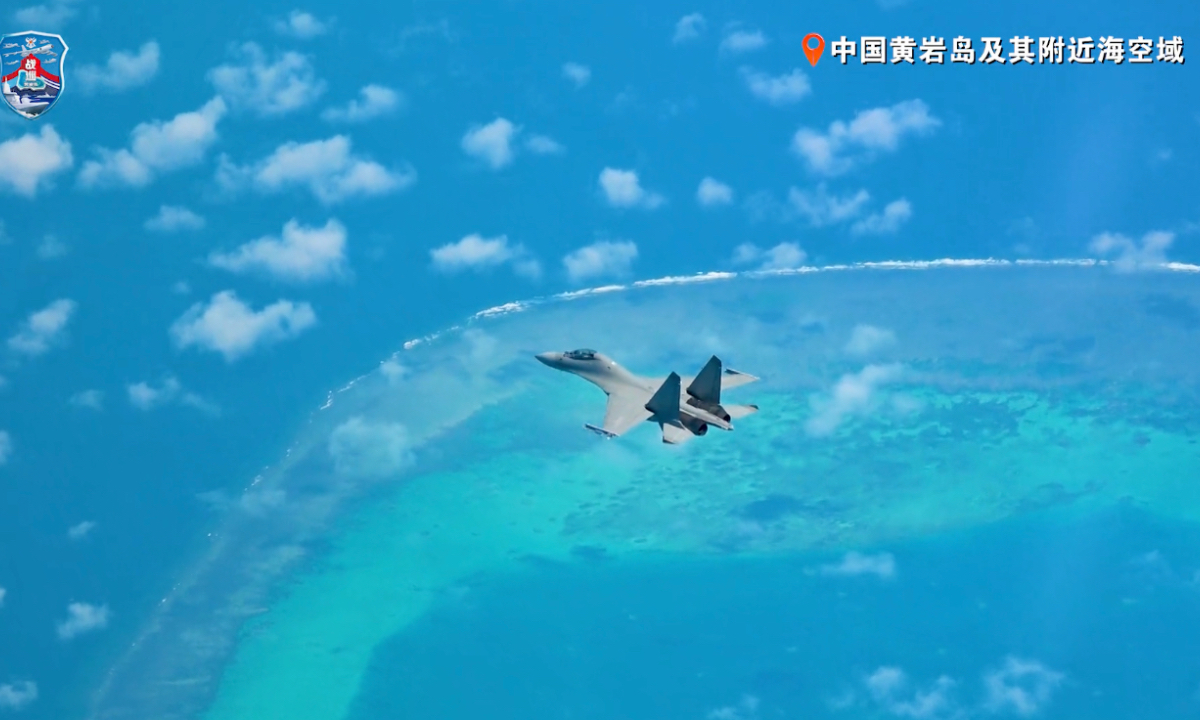 The naval and air units of the People's Liberation Army (PLA) conducted readiness patrols in the territorial sea and airspace of China’s Huangyan Dao and its surrounding areas. Screenshot from a video released by PLA Southern Theater Command 