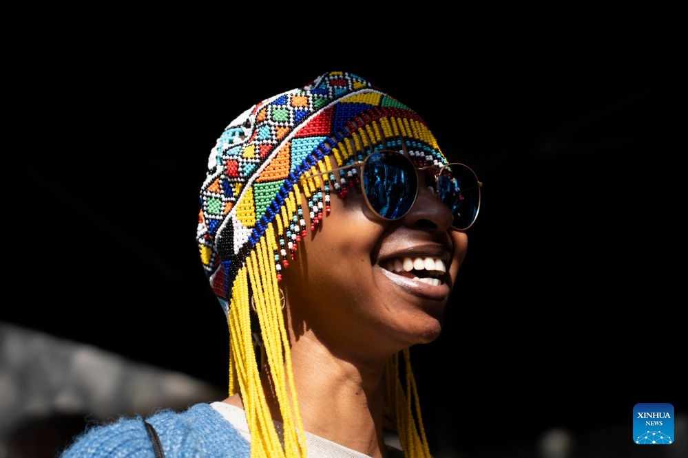 A woman takes part in activities on a street during a car-free event in Johannesburg, South Africa, Aug. 9, 2026. During the event, some streets in Johannesburg were turned into car-free zones from 10 a.m. to 5 p.m., with motor vehicles banned. (Photo by Ihsaan Haffejee/Xinhua)