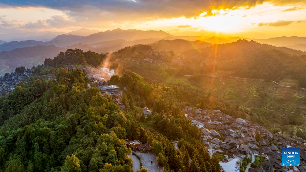 An aerial drone photo taken on Sept. 28, 2026 shows a sunset view of the Basha Village in Congjiang County of Qiandongnan Miao and Dong Autonomous Prefecture, southwest China's Guizhou Province. Located seven kilometers away from the county seat of Congjiang, Basha Village has attracted an increasing number of overseas tourists with its charming scenery and simple folk customs recently.
Consisting of five hamlets and inhabited by the Miao people, the village was included in the first batch of China's traditional villages in 2012. Riding the viral Chinamaxxing wave on social media, foreign tourists have come here to experience ancient ways of life and profound cultural heritage.
Data from the National Immigration Administration shows that China recorded 22.91 million inbound foreign visits in the first half of this year, up 20.4 percent year on year. (Photo by Wu Dejun/Xinhua)