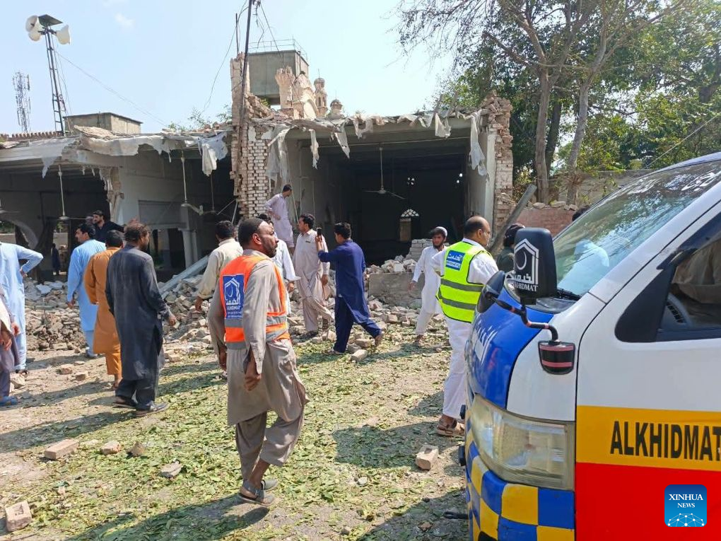 This photo taken with mobile phone shows a blast site at Kohat in Pakistan's Khyber Pakhtunkhwa province on Sept. 18, 2026. At least 16 people were killed and over 50 others injured in a twin suicide attack inside a residential compound of police in Pakistan's Khyber Pakhtunkhwa province on Friday, police and rescue officials said. (Str/Xinhua)