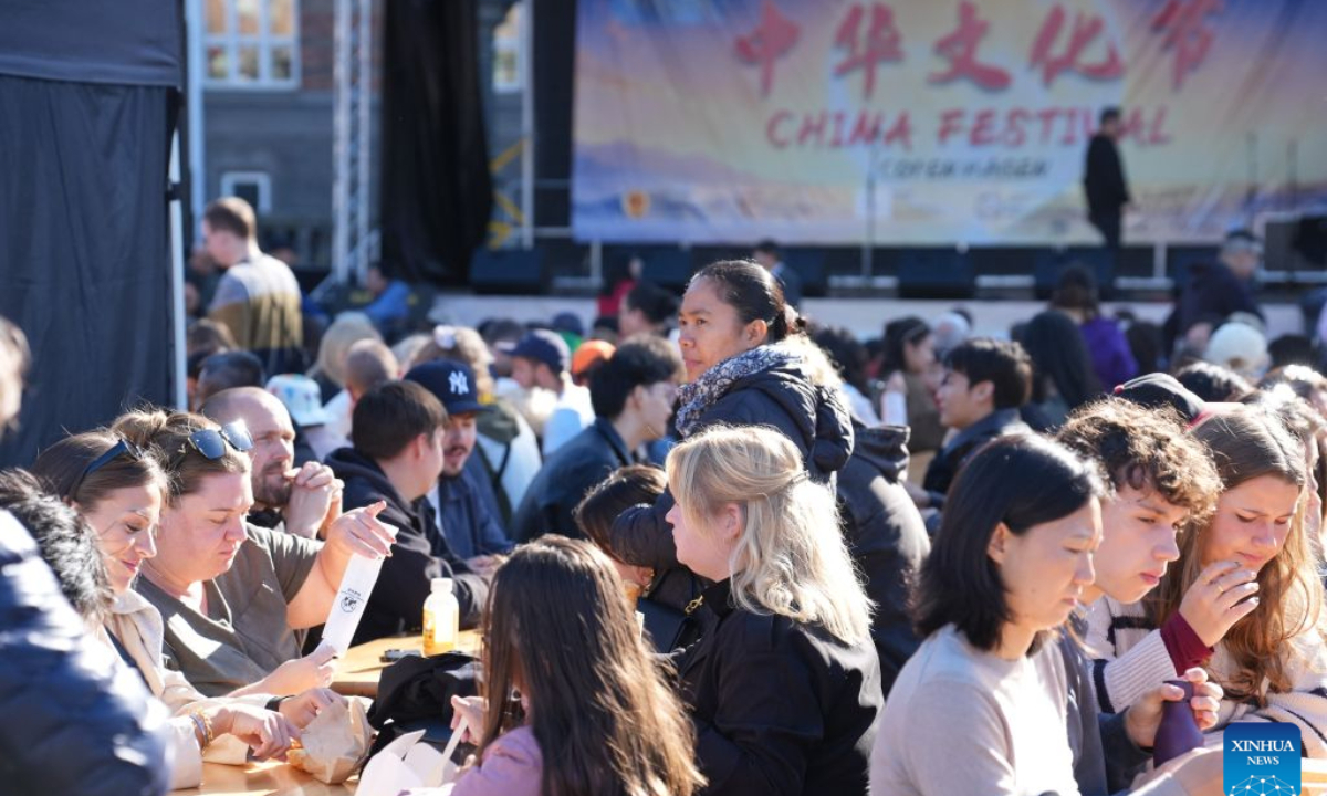 People attend the first Copenhagen China Festival at Copenhagen City Hall Square in Copenhagen, Denmark, Sept. 27, 2026. Drums, lion dances, opera movements and the aroma of Chinese food filled Copenhagen's City Hall Square on Sunday as the first Copenhagen China Festival was held in celebration of the Mid-Autumn Festival.(Photo by Liu Zhichao/Xinhua)