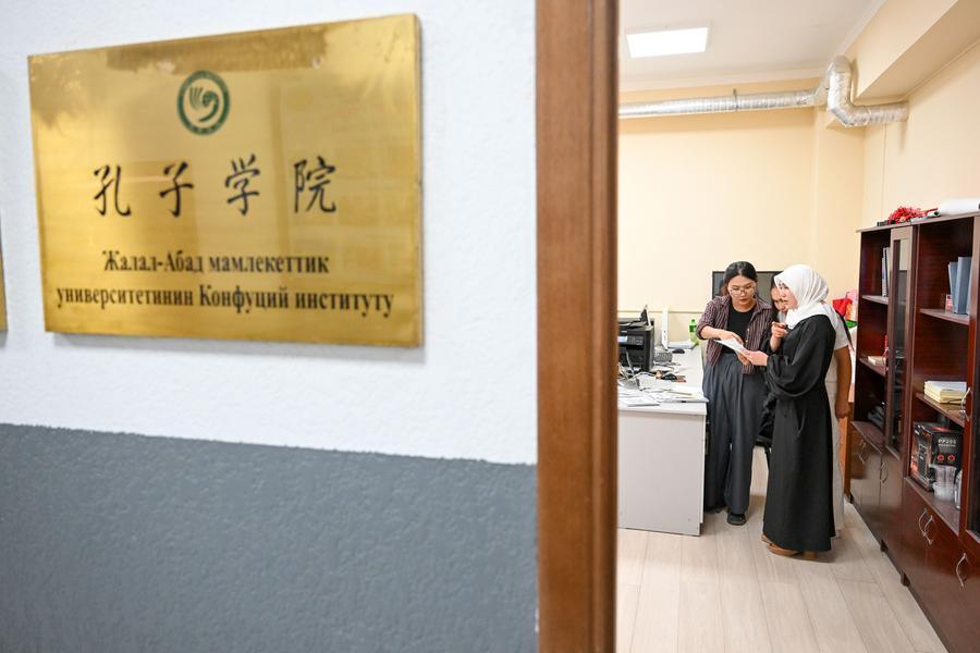 A teacher tutors students during a break at the Confucius Institute at the Jalal-Abad State University in Manas City, Kyrgyzstan, Sept. 23, 2026. (Xinhua/Ding Lei)