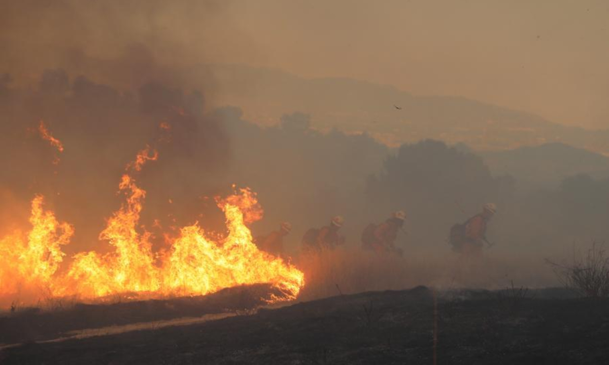 Firefighters move to battle the wildfire in Ventura County, California, the United States, Aug. 7, 2025.  (Photo by Qiu Chen/Xinhua)