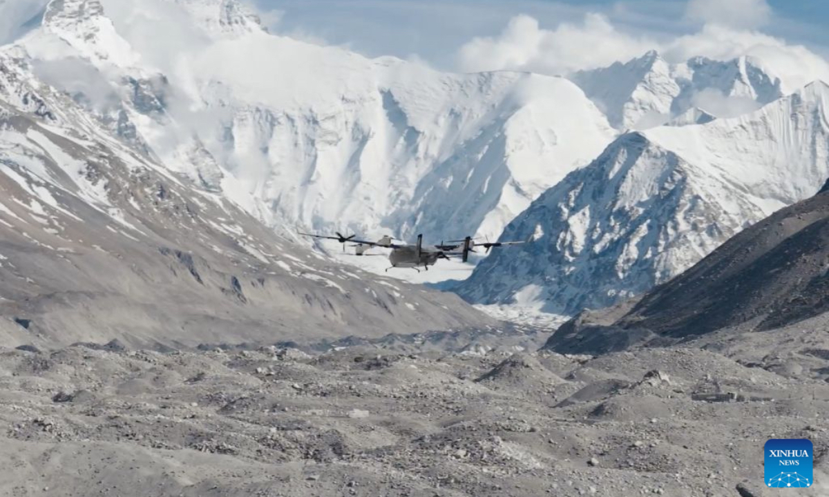 This photo shows DJI EV50, a latest vertical take-off and landing fixed-wing hybrid drone, working on the northern slope of Mount Qomolangma in southwest China's Xizang Autonomous Region, on May 21, 2026. A joint Chinese scientific expedition team has successfully measured vertical ozone distribution data from the ground up to an altitude of 8,861 meters above sea level in the Mount Qomolangma area. Using the latest vertical take-off and landing fixed-wing hybrid drone, the joint team from the Peking University (PKU) and Chinese Academy of Sciences also fully captured the entire process of downward ozone transport driven by glacier winds. These achievements have added a crucial piece of observational evidence to the study of high-concentration ozone and its changing trends over the Qinghai-Tibet Plateau in western China. (Xinhua)