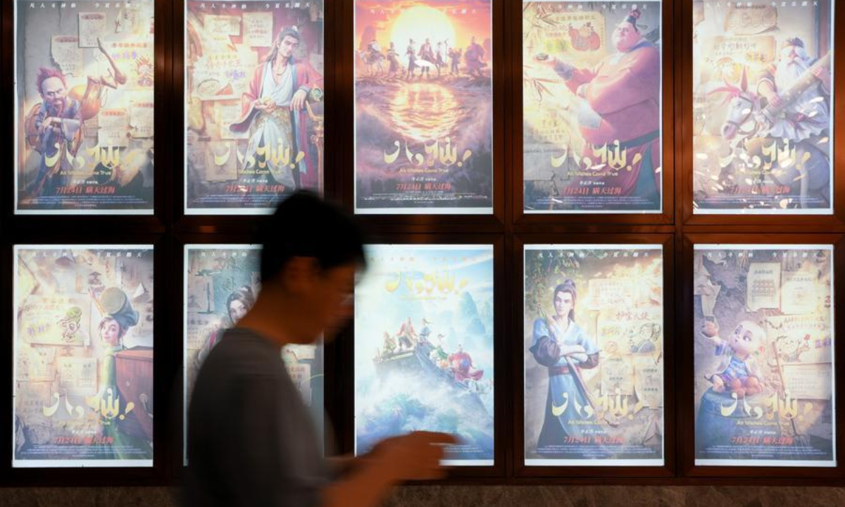 A citizen walks past film posters at a cinema in Chengdu, southwest China's Sichuan Province, on July 23, 2026. (Xinhua/Xu Bingjie)