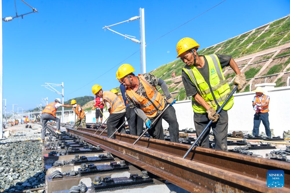 Workers lay tracks along the Chongqing-Wanzhou High-Speed Railway in Wanzhou District of Chongqing, southwest China, Sept. 1, 2026.

The Chongqing-Wanzhou High-Speed Railway completed track laying on Tuesday, paving the way for the 350 km/h line's planned opening. (Xinhua/Tang Yi)