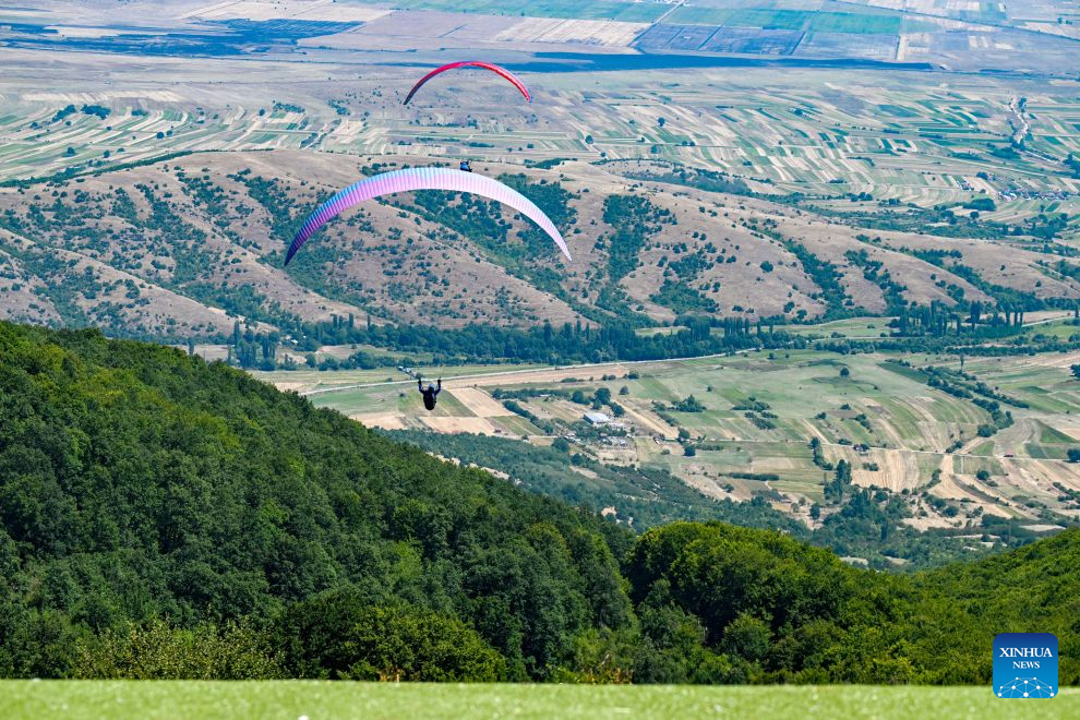 Participants compete during the 18th World Air Sports Federation (FAI) European Paragliding Championships in Krushevo, North Macedonia, Aug.16, 2026. The event is taking place from Aug. 8 to 19, bringing together 130 of Europe's top pilots. (Photo by Tomislav Georgiev/Xinhua)