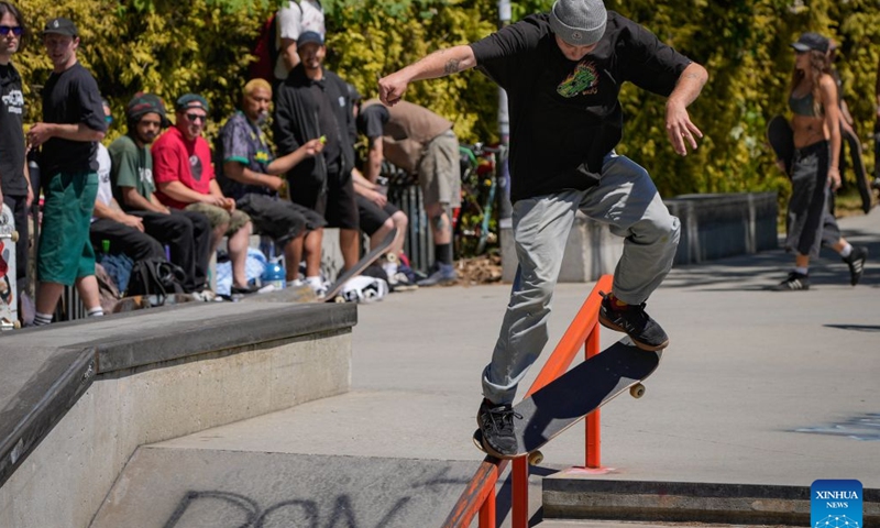 A skateboarder performs a trick during a Go Skateboarding Day event in Vancouver, British Columbia, Canada, on June 21, 2026. (Photo by Liang Sen/Xinhua)