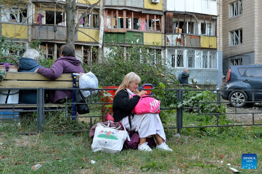 People evacuate from a building damaged in a Russian overnight missile and drone attack in Kiev, Ukraine, Aug. 20, 2026. A Russian overnight missile and drone attack hits Kiev, Ukraine, on August 20, 2026. (Photo by Peter Druk/Xinhua)