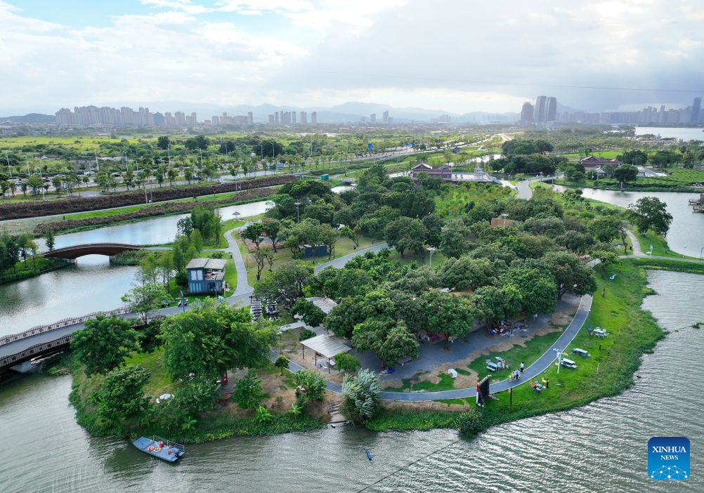 An aerial drone photo taken on Aug. 19, 2026 shows a view of Longjiang Suiyue park in Zhangzhou, southeast China's Fujian Province. Longjiang Suiyue park, a cultural and tourism complex, was transformed from an area with dilapidated buildings, widespread garbage, and wasted water. The renovated park officially opened on Dec. 31, 2024, and has attracted over 18 million visitors as of this June. (Xinhua/Lin Shanchuan)