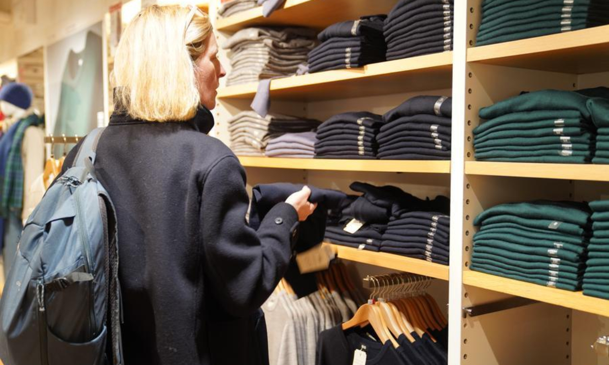 A woman shops at a store in New York, the United States, on Oct. 16, 2025. (Xinhua/Zhang Fengguo)
