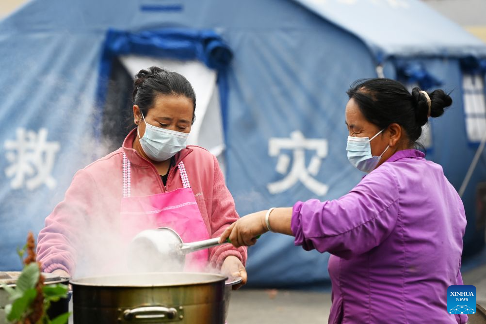 Villagers boil water at a temporary relocation site in Madang Town, Xiahe County of the Tibetan Autonomous Prefecture of Gannan, northwest China's Gansu Province, July 16, 2026. Severe convective weather triggered mountain torrents here from July 13 to 14. Two temporary relocation sites were set up in Madang Town to accommodate 107 affected residents. (Xinhua/Fan Peishen)