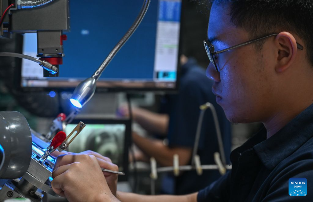 A staff member conducts laser welding at a workshop in Fengjie County, southwest China's Chongqing Municipality, Sept. 15, 2026. In recent years, Fengjie County has vigorously developed its eyewear industry, which provided over 3,500 new jobs, with products exported to more than 30 countries and regions. (Xinhua/Chen Cheng)