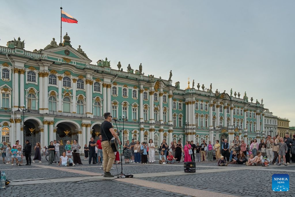 People enjoy music at Palace Square of St. Petersburg, Russia, June 21, 2026.

St. Petersburg's White Nights is a spectacular summer phenomenon where the city's high northern latitude prevents the sky from getting completely dark. (Photo by Guo Feizhou/Xinhua)