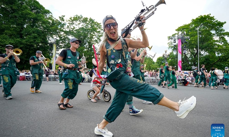 Participants are pictured during a parade of the Gaudeamus Baltic Student Song and Dance Festival in Riga, Latvia, June 21, 2026. Thousands of university students from Latvia, Lithuania, and Estonia gathered in the Latvian capital to participate in Gaudeamus, the milestone cultural event, celebrating youth and Baltic traditions. (Photo by Edijs Palens/Xinhua)