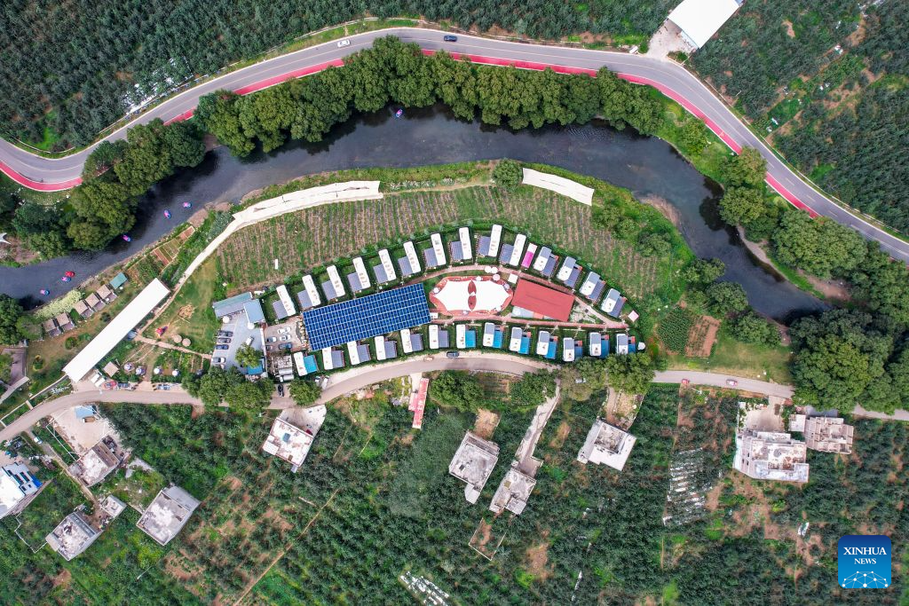 An aerial drone photo taken on Aug. 13, 2026 shows a hot spring hotel in Xunlong Village of Sayu Town, Zhaoyang District in Zhaotong City, southwest China's Yunnan Province. In recent years, Zhaoyang District in Zhaotong City has leveraged its cool and pleasant climate to boost the in-depth sojourn tourism experience as a summer retreat.

The local government has introduced special support policies for summer retreat tourism, optimizing services including dining, lodging, transportation, sightseeing, shopping, and entertainment. (Xinhua/Chen Xinbo)