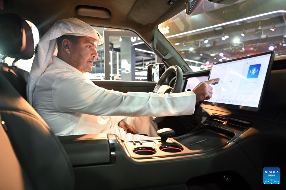 A man sits inside a car at an auto show in Hawalli Governorate, Kuwait, Sept. 21, 2026. An auto show opened at the Kuwait International Fairground in Hawalli Governorate on Monday. (Photo by Asad/Xinhua)