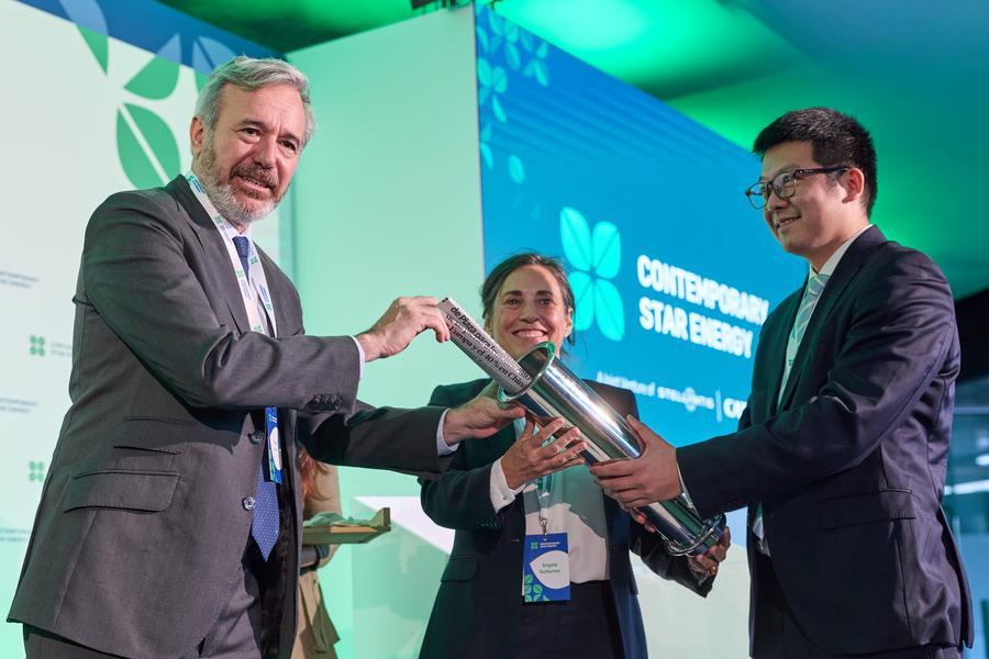 Aragon regional president Jorge Azcon (L) seals a copy of the day's edition of Heraldo de Aragon into a time capsule during the groundbreaking ceremony in Zaragoza, Spain, Nov. 26, 2025. A joint venture between China's CATL and multinational automaker Stellantis broke ground on Tuesday for a major lithium iron phosphate (LFP) battery plant in Spain's northeastern region of Aragon, marking one of the largest Chinese industrial investments in the country. (Xinhua/Meng Dingbo)