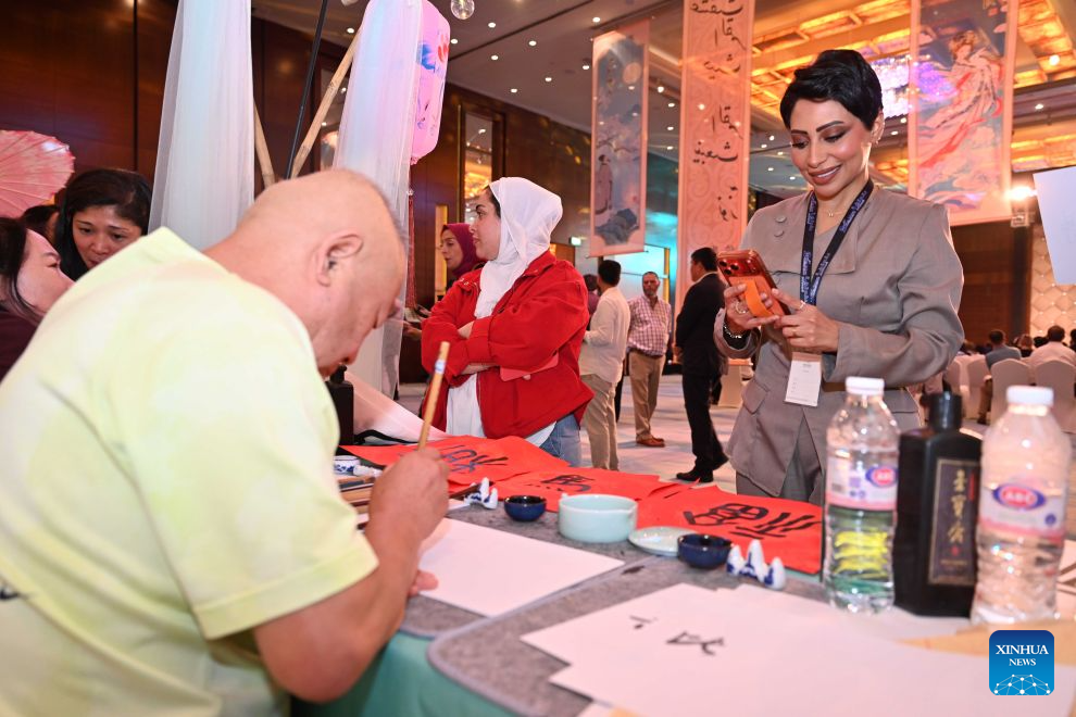 People attend a cultural event showcasing the traditions and tourism resources of north China's Hebei Province in Farwaniya Governorate, Kuwait, Sept. 19, 2026. The event kicked off here on Saturday evening, drawing more than 300 guests. (Photo by Asad/Xinhua)