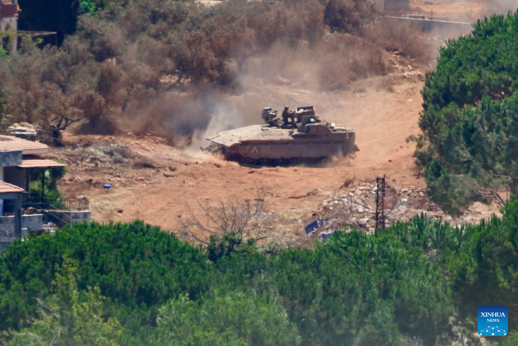 This photo taken on Aug. 3, 2026 shows an Israeli military vehicle stationed in Zawtar al-Sharqiyah, southern Lebanon. The Lebanese army said on July 26 that continued Israeli attacks and violations of existing understandings are obstructing its deployment in southern Lebanon and delaying the return of residents to their border villages. (Photo by Ali Hashisho/Xinhua)