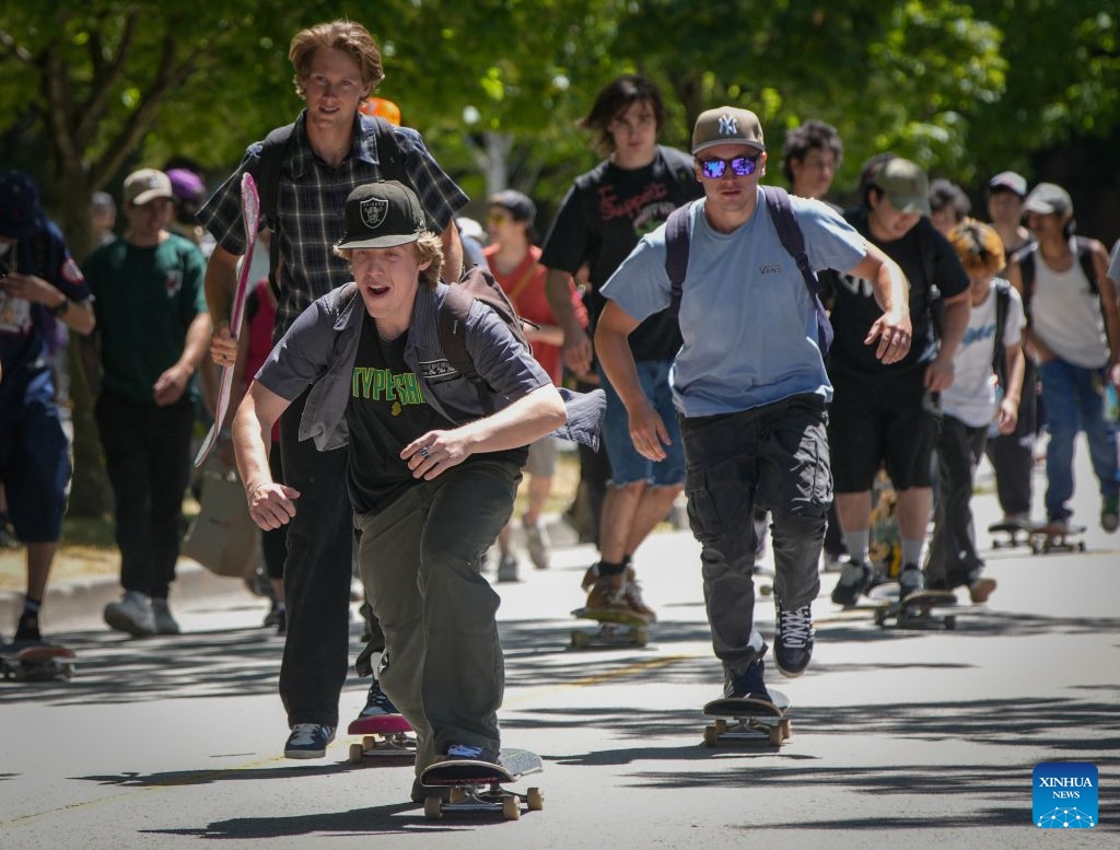 Skateboarders cruise along a street during a Go Skateboarding Day event in Vancouver, British Columbia, Canada, on June 21, 2026. (Photo by Liang Sen/Xinhua)
