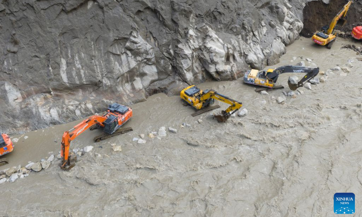 This aerial drone photo shows excavators repairing a section of national highway G216 in Gyirong County, southwest China's Xizang Autonomous Region, on Aug. 31, 2026.

Rescuers with China Anneng are carrying out clearing and restoration operations on the damaged road sections, striving to restore the vital access route to Gyirong Port. (Xinhua/Jiang Fan)