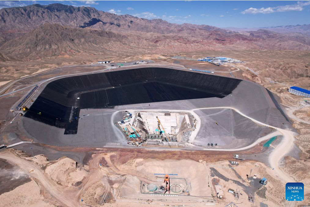 An aerial drone photo shows the construction site of a pumped-storage power station in Zhangye, northwest China's Gansu Province, Aug. 4, 2026. The construction of the power station started in 2022, and all the four 350,000-kW reversible pump-turbine units are expected to be fully put into operation by 2029. (Xinhua/Fan Peishen)