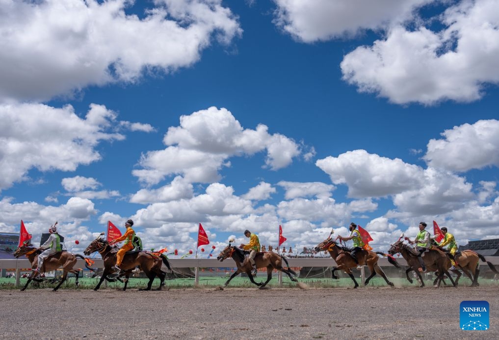 Horse racers compete during the invitational 12,000m walking race of famous horse at the Nagqu Horse Racing Festival 2026 at Gesar Racecourse in Nagqu, southwest China's Xizang Autonomous Region, Aug. 10, 2026. Featuring traditional equestrian contests, ethnic sports performances and trade fair, the event kicked off here on Monday, drawing large crowds of locals and visitors. (Xinhua/Sun Fei)