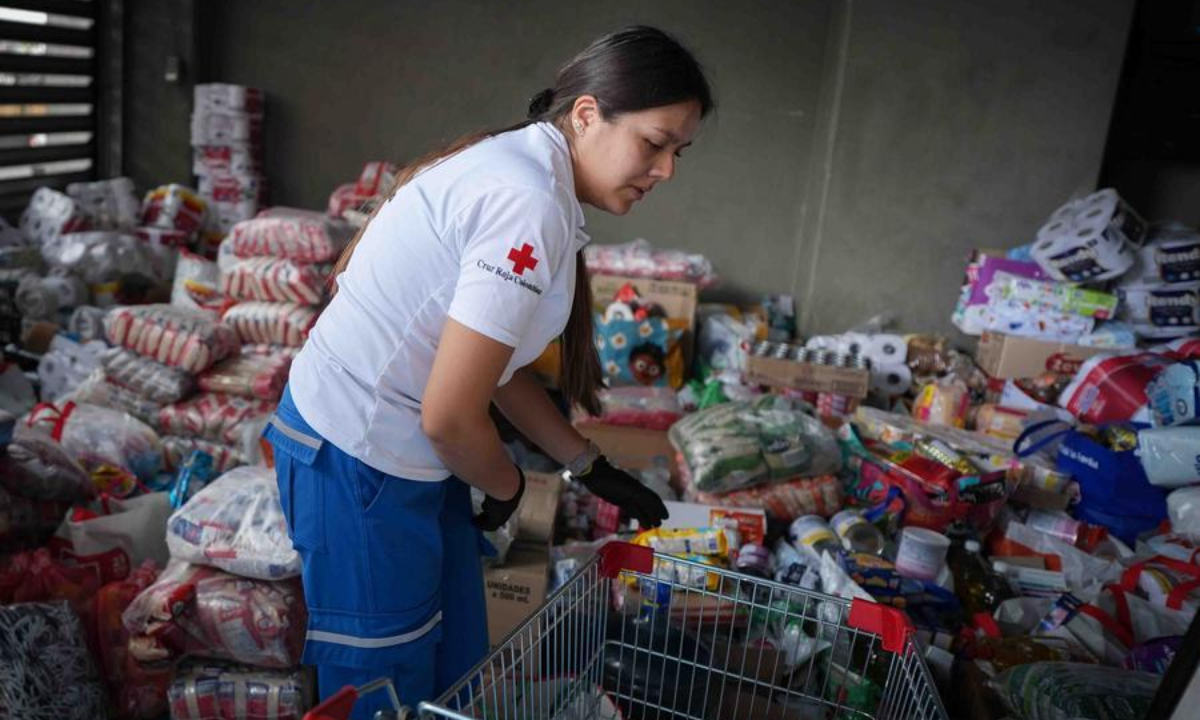 A member of Colombian Red Cross organizes donated food and relief supplies following Monday's 7.4-magnitude earthquake in Bogota, Colombia, on Aug. 11, 2026. (Photo by Andres Moreno/Xinhua)