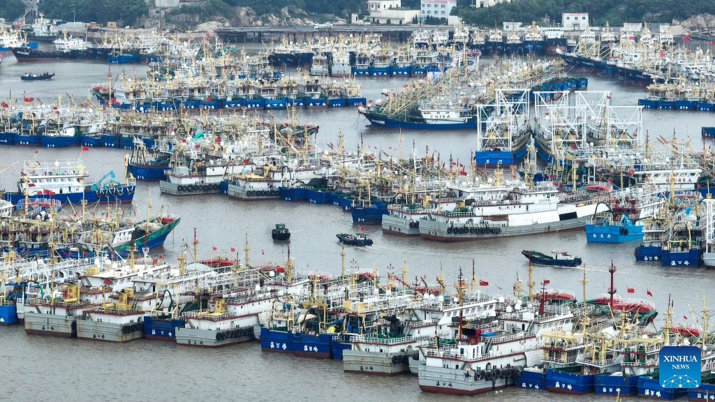 A drone photo shows fishing boats taking shelter from the upcoming typhoon at a port in Wenling, east China's Zhejiang Province, Aug. 5, 2026.
As Typhoon Dolphin, the 13th typhoon of 2026, is approaching the East China Sea, Zhejiang activated an emergency response along its coastal areas from 6 p.m. Wednesday. (Photo by Zhou Xuejun/Xinhua)