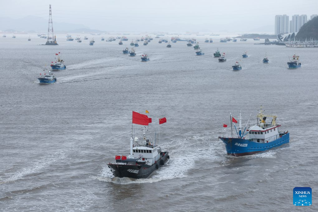 Fishing boats set sail for fishing from Shenjiamen Port in Zhoushan, east China's Zhejiang Province, Aug. 11, 2026. Four types of fishing boats with special permission set sail on Tuesday after a three-month summer fishing ban in the East China Sea. The opening of the fishing season was delayed from the originally scheduled Aug. 5 due to Typhoon Dolphin. (Xinhua/Xu Yu)