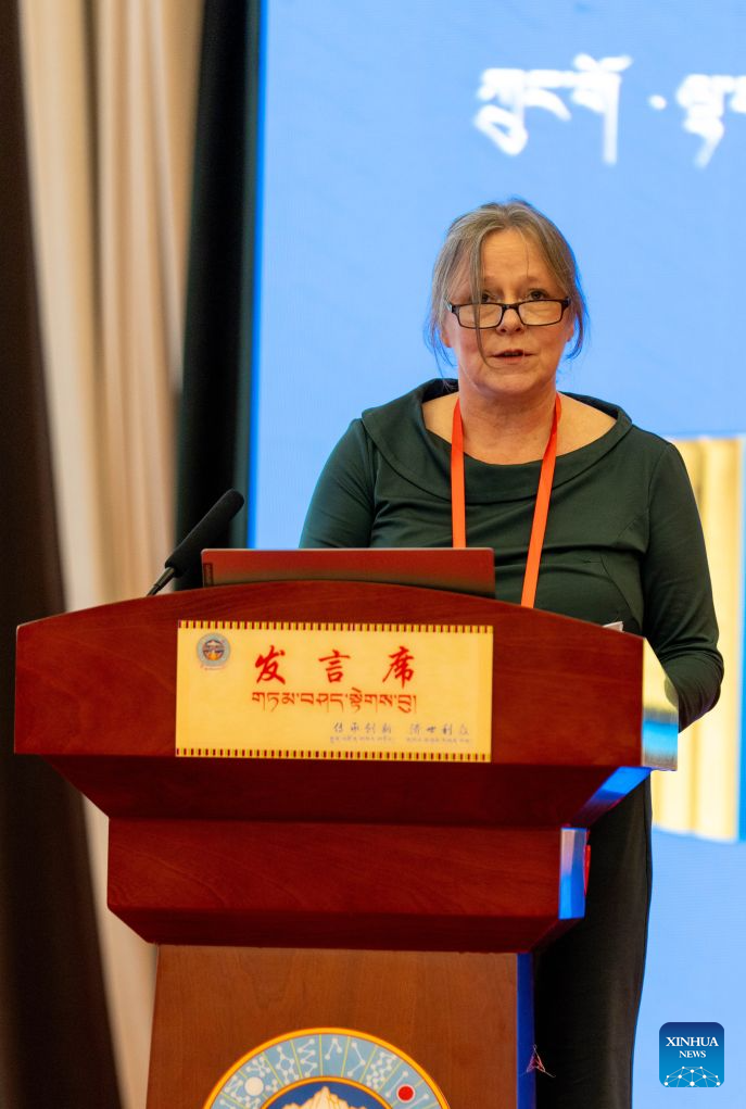 Katharina Anna Sabernig from the Medical University of Vienna, Austria, delivers a speech at the second international academic symposium on The Four Treatises of Tibetan Medicine and Tibetan medical thangkas in Lhasa, southwest China's Xizang Autonomous Region, Aug. 20, 2026. (Xinhua/Tenzing Nima Qadhup)
