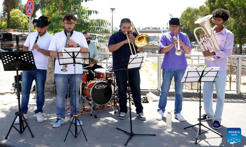 Members of a Syrian jazz band perform during a celebration marking World Music Day in central Damascus, Syria, on June 21, 2026. (Photo by Ammar Safarjalani/Xinhua)