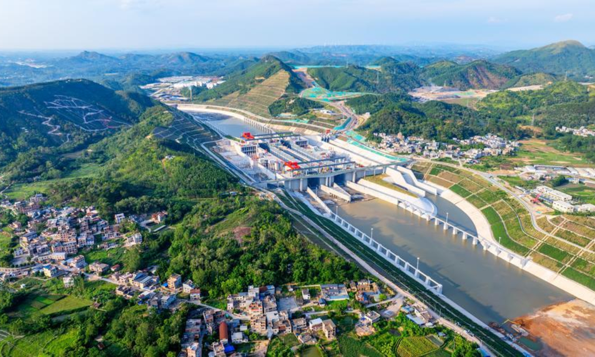 An aerial drone photo taken on June 3, 2026 shows water being pumped into the Madao hub on the Pinglu Canal in south China's Guangxi Zhuang Autonomous Region. (Photo by Zhao Zhenyu/Xinhua)