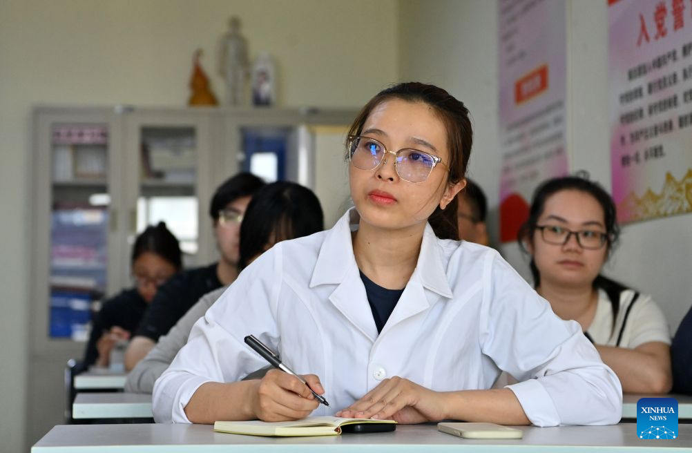 Thai Thi Hai Yen attends a lecture at the First Affiliated Hospital of Guangxi University of Chinese Medicine in Nanning, south China's Guangxi Zhuang Autonomous Region, Sept. 17, 2026.
Vietnamese scholar Thai Thi Hai Yen, 33, enrolled at Guangxi University of Chinese Medicine (GUCM) in September 2025 to pursue her doctoral degree in traditional Chinese internal medicine under the supervision of Professor Chen Guozhong from the university's First Affiliated Hospital. After one year of intensive Chinese language training, she officially commenced her professional traditional Chinese medicine (TCM) studies this September.
Yen's pursuit in TCM began long before her arrival in China. She obtained her bachelor's and master's degrees in TCM from Vietnam University of Traditional Medicine before she was employed by Da Nang Rehabilitation Hospital. She is now studying diligently to refine her clinical expertise in China.
After earning my PhD, I plan to return to Da Nang Rehabilitation Hospital and integrate TCM with multidisciplinary rehabilitation therapies to achieve better treatment outcomes for my patients, Yen said.
A time-honored hub for TCM education and cultural exchange with ASEAN nations, GUCM capitalizes on its strengths in both TCM and distinctive Zhuang ethnic medicine. The university has been attracting ASEAN students, boosting professional exchanges, and facilitating China-ASEAN cooperation in traditional medicine and people-to-people connectivity. (Xinhua/Lu Boan)