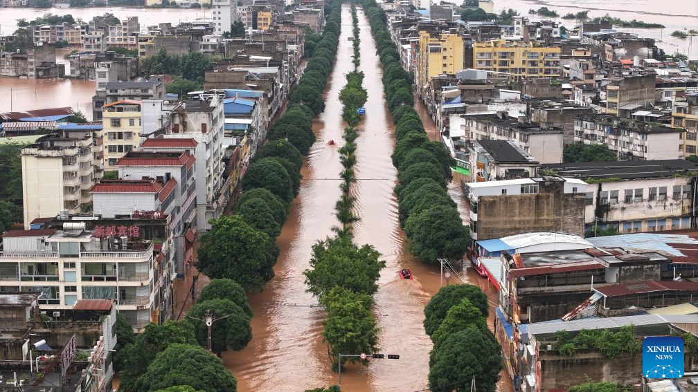 An aerial drone photo taken on Aug. 23, 2026 shows a view of Ningming County, in south China's Guangxi Zhuang Autonomous Region. For days, Ningming County has been battered by typhoon-triggered heavy rainfall. Response forces have pooled their efforts to urgently evacuate stranded residents. (Xinhua/Zhou Hua)