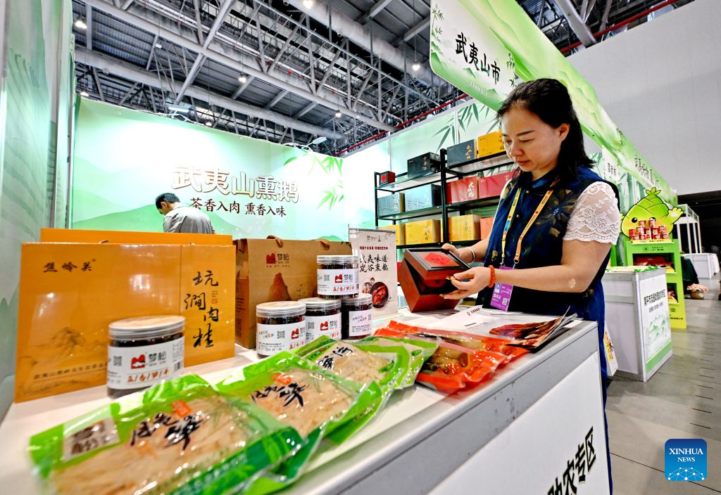 A staff member arranges agricultural products from Wuyishan City of Fujian Province at the venue of the 26th China International Fair for Investment & Trade (CIFIT) in Xiamen, southeast China's Fujian Province, Sept. 7, 2026. The 26th CIFIT is slated to be held here from Sept. 8 to 11. (Xinhua/Lin Shanchuan)