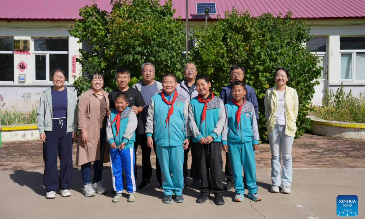 Teachers and part of the students pose for a group photo at Sandun Primary School in Sandun Village, Huayuantun Town of Datong, north China's Shanxi Province, Sept. 9, 2026. (Xinhua/Yang Chenguang)
