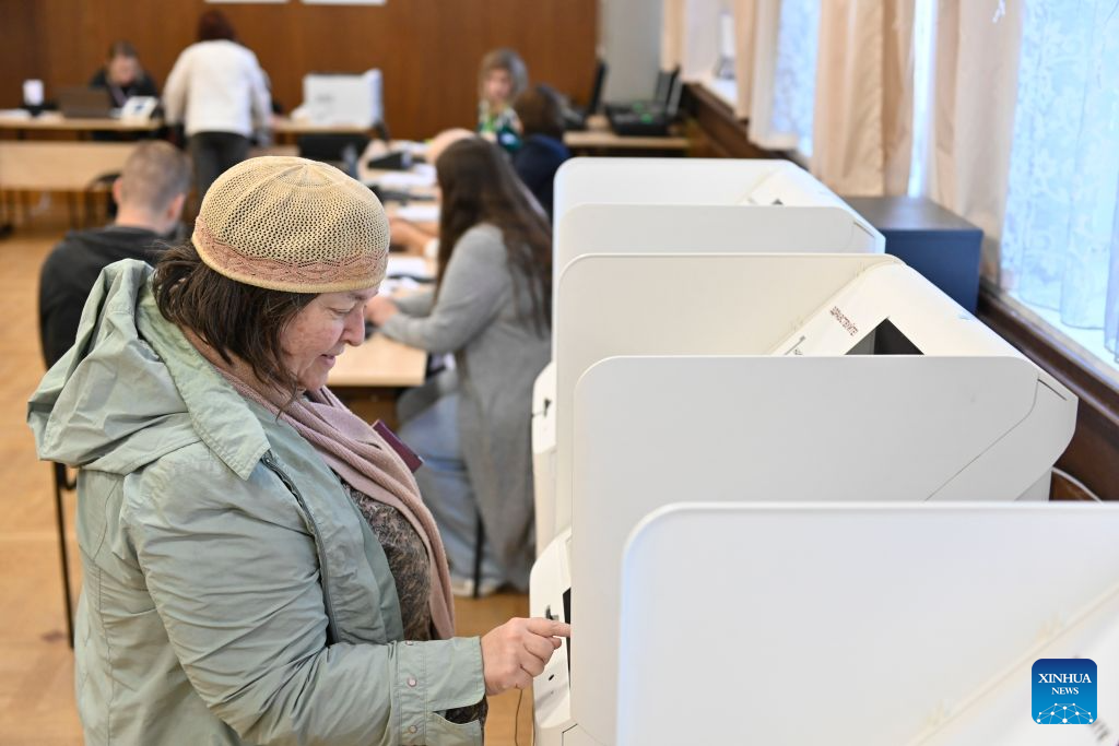 A voter casts her ballot at a polling station in Moscow, Russia, on Sept. 20, 2026. Elections for deputies to the ninth convocation of the State Duma, the lower house of parliament, ran from Sept. 18 to 20. (Photo by Alexander Zemlianichenko Jr/Xinhua)