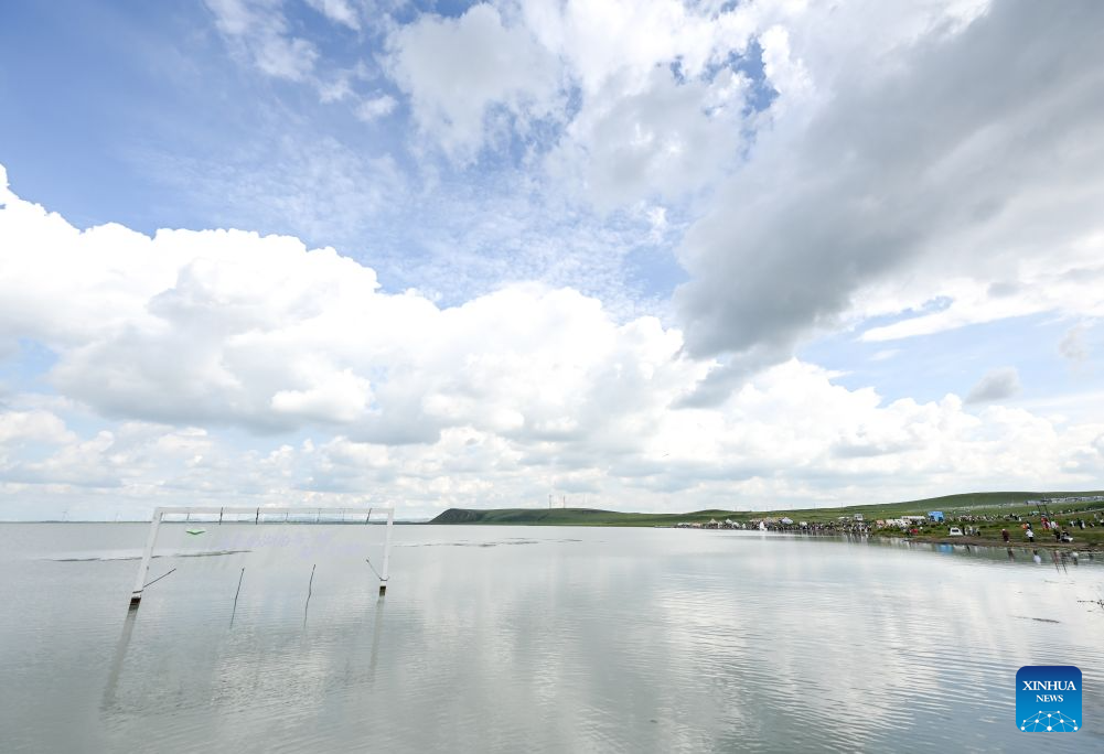 This photo taken on Aug. 4, 2026 shows a view of Baiyin Chagan Lake, or Milky Lake, in Xilin Gol League, north China's Inner Mongolia Autonomous Region. The lake is dubbed Milky Lake as tiny mineral particles float in the water, turning it creamy-white like milk. (Xinhua/Lian Zhen)