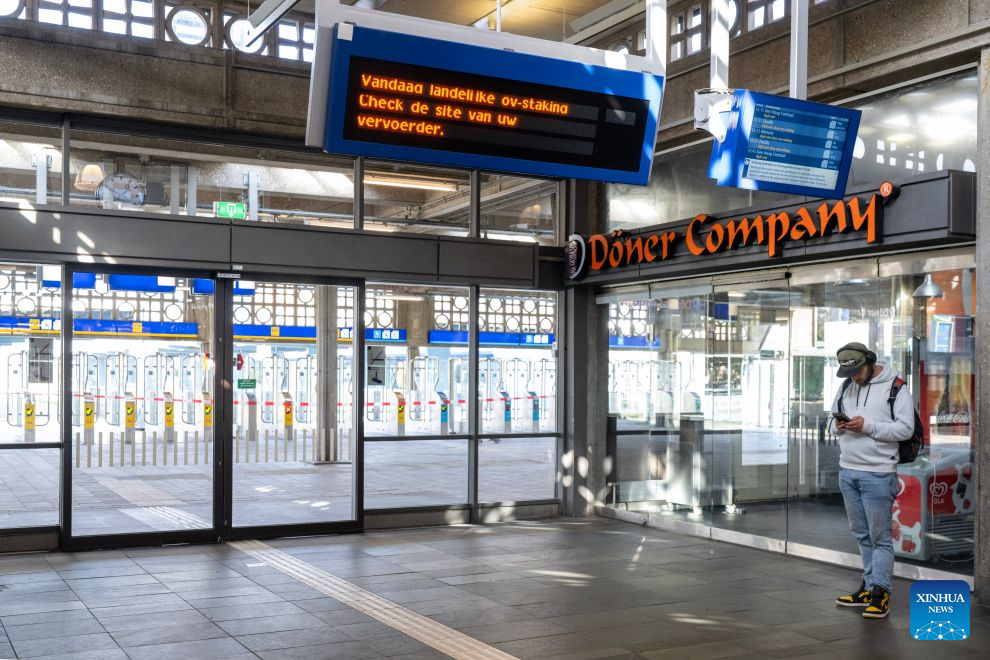 A man stands outside the closed entrance of Enschede train station in Enschede, the Netherlands, on Sept. 9, 2026. Dutch trade unions announced a nationwide 24-hour public transport strike for Sept. 9, in protest against Dutch government's planned social security cuts. (Photo by Eric Brinkhorst/Xinhua)