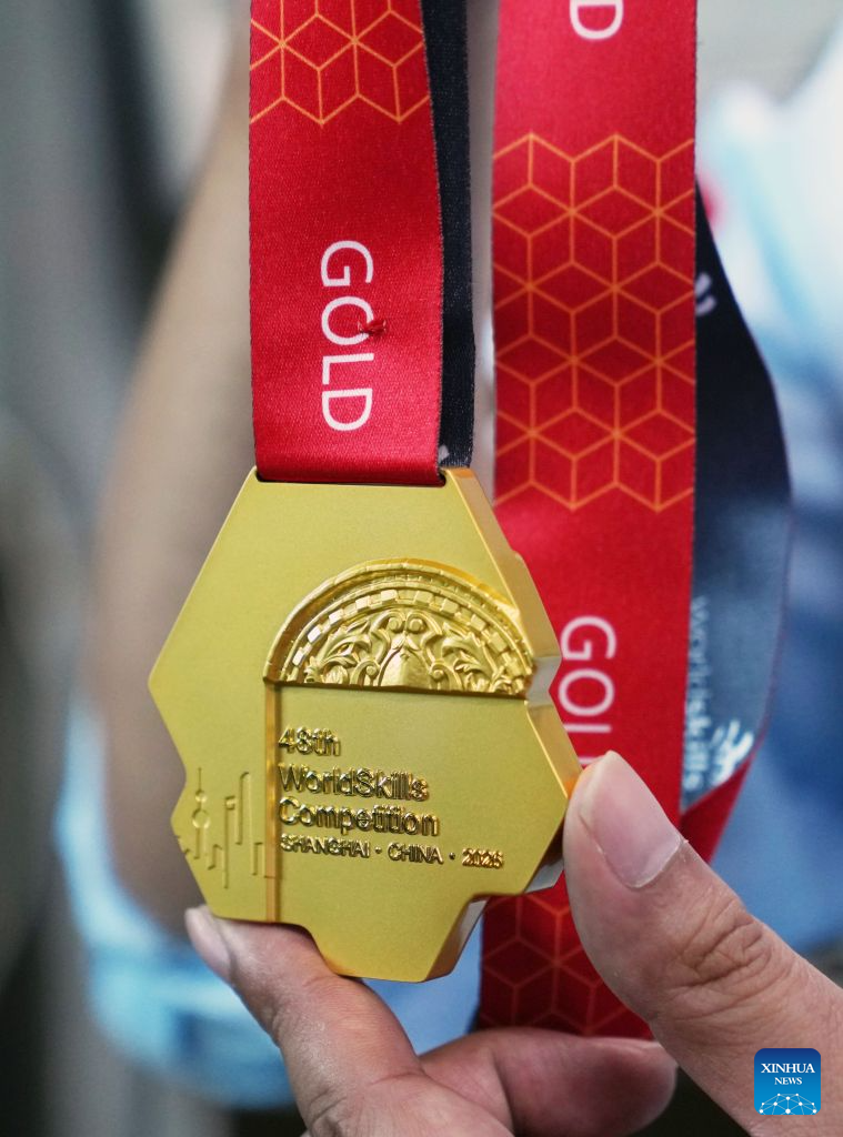 This photo taken on Sept. 8, 2026 shows the pattern on the back of the gold medal of the 48th WorldSkills Competition. Shanghai Mint Co., Ltd. has officially shipped all the medals for the 48th WorldSkills Competition recently, which will be awarded at the competition scheduled to take place in Shanghai from Sept. 22 to 27. (Xinhua/Liu Ying)